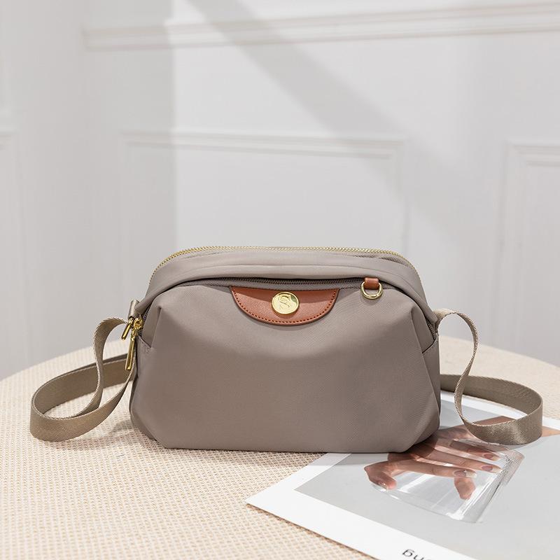 

Новая летняя женская сумка из ткани Оксфорд, простая и легко сочетаемая, сумка для поездок на работу, большая вместимость, на одно плечо, через плечо, нейлоновая парусиновая сумка