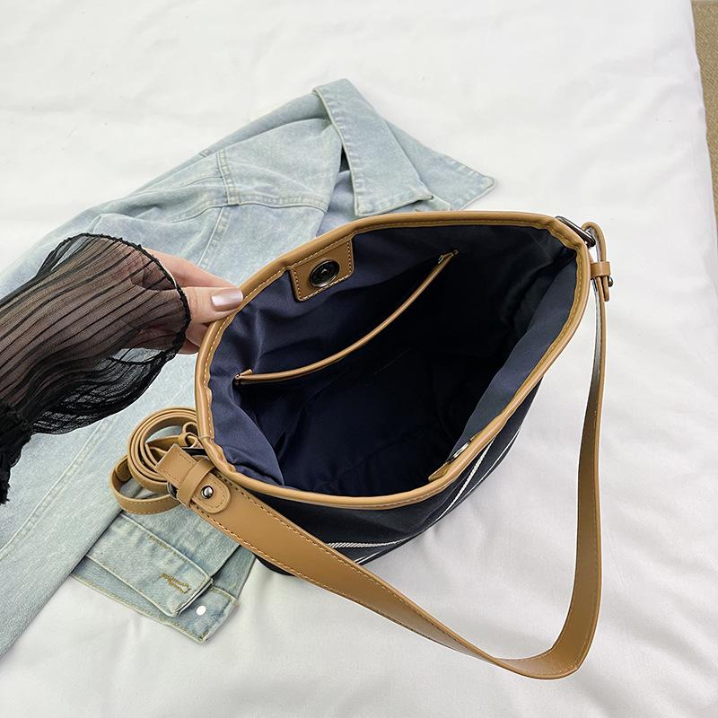 New fashion niche contrasting color striped bucket bag single shoulder oblique span trendy women's bag