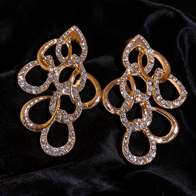 Elegant Water Drop Diamond Hollow Earrings - Silver Needle, European & American Style, Exaggerated Fashion, Luxurious High-End Design.