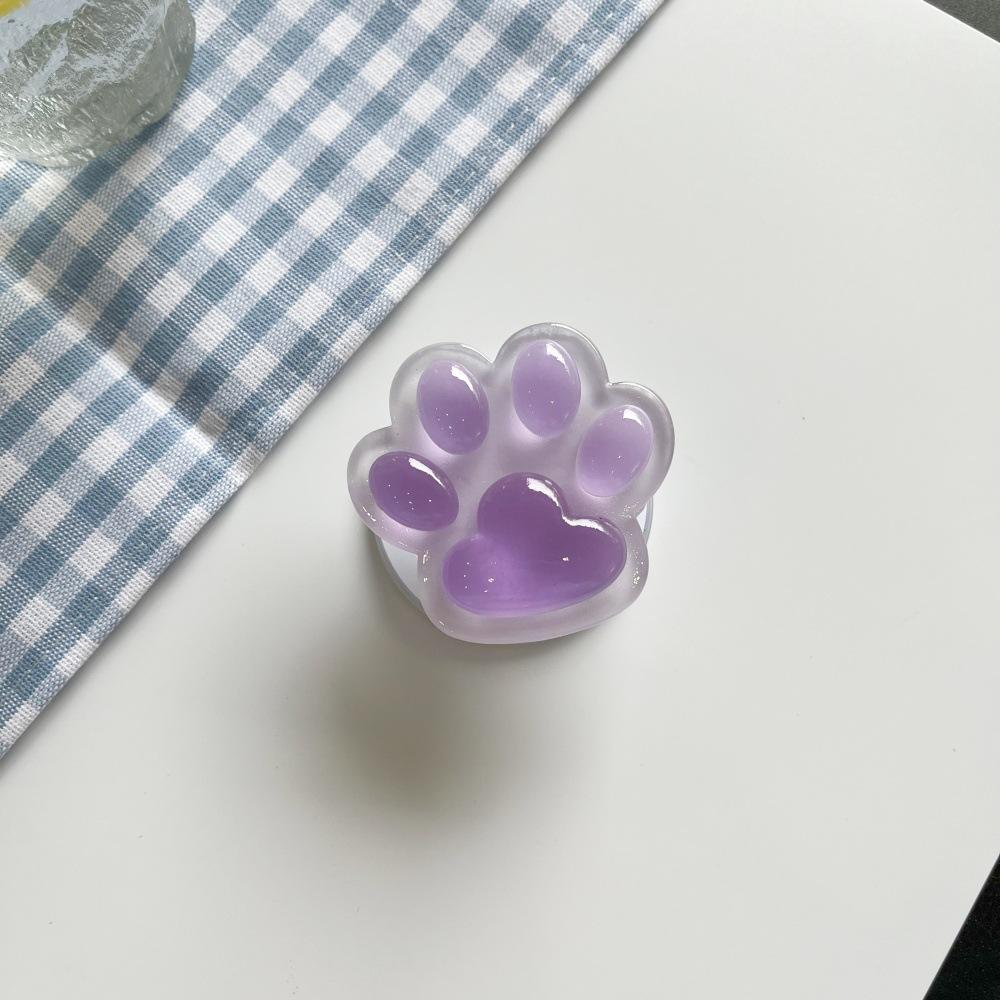 

Colorful Glow-in-the-Dark Cat Paw Phone Air Cushion Stand, Magnetic Retractable Lazy Desktop Drama Watching Stand фіолетовий
