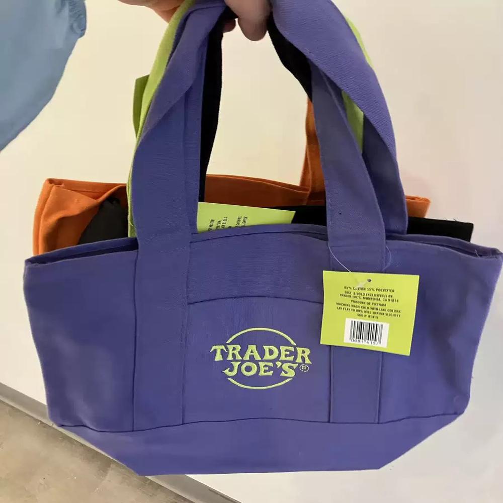 Official Trader Joe's Trick or Treat Tote Bag - Purple Reusable Canvas Bag for Groceries Cycling Errands Cafe Outings