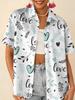 Gentle blue floral printed shirt for women, short-sleeve loose lapel design, niche vacation style top