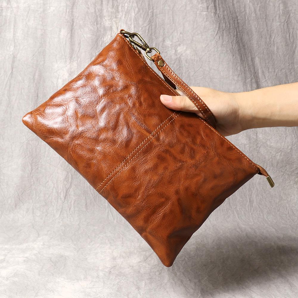 

Vintage Leather Unisex Clutch: Stylish, Pleated Large Capacity Wrist Bag for Documents