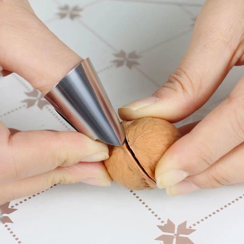 

Нож для большого пальца и защита для пальца из нержавеющей стали для сбора овощей и чистки чеснока. 1 Piece Stainless Steel Nail Sleeve