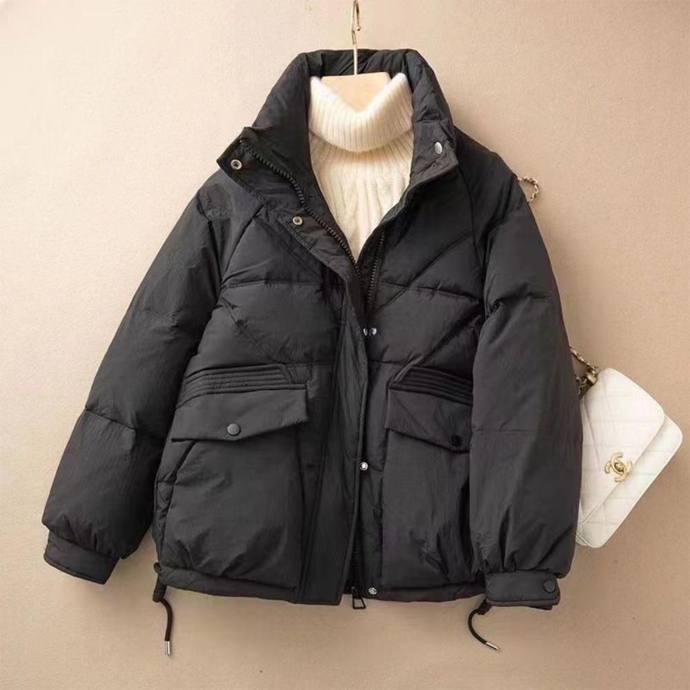 The new versatile down cotton-padded jacket with a loose stand-up collar and thickened coat in the Korean style is trendy