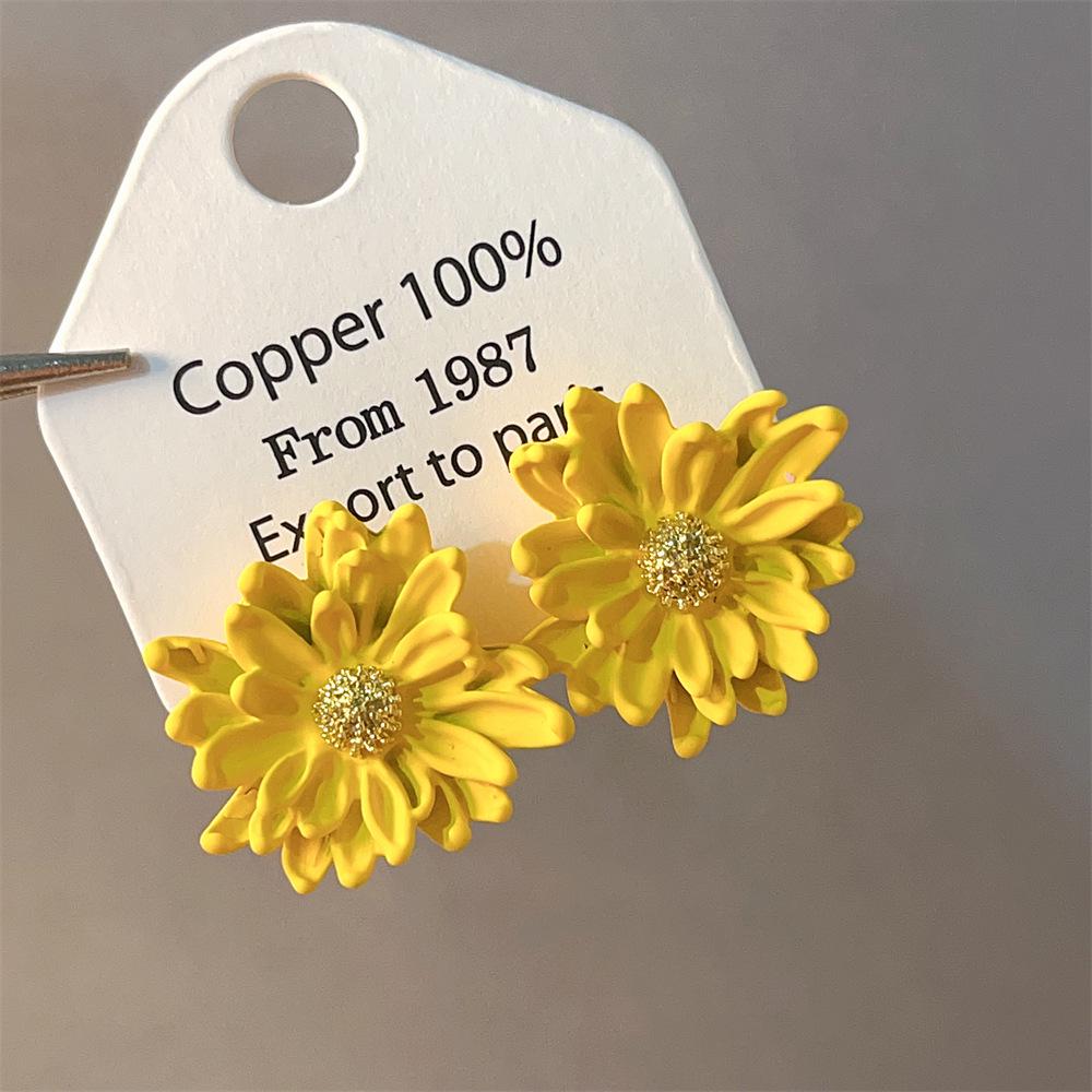 Boucles d'oreilles bohèmes roses à fleurs de perles de rocaille et pompons de perles