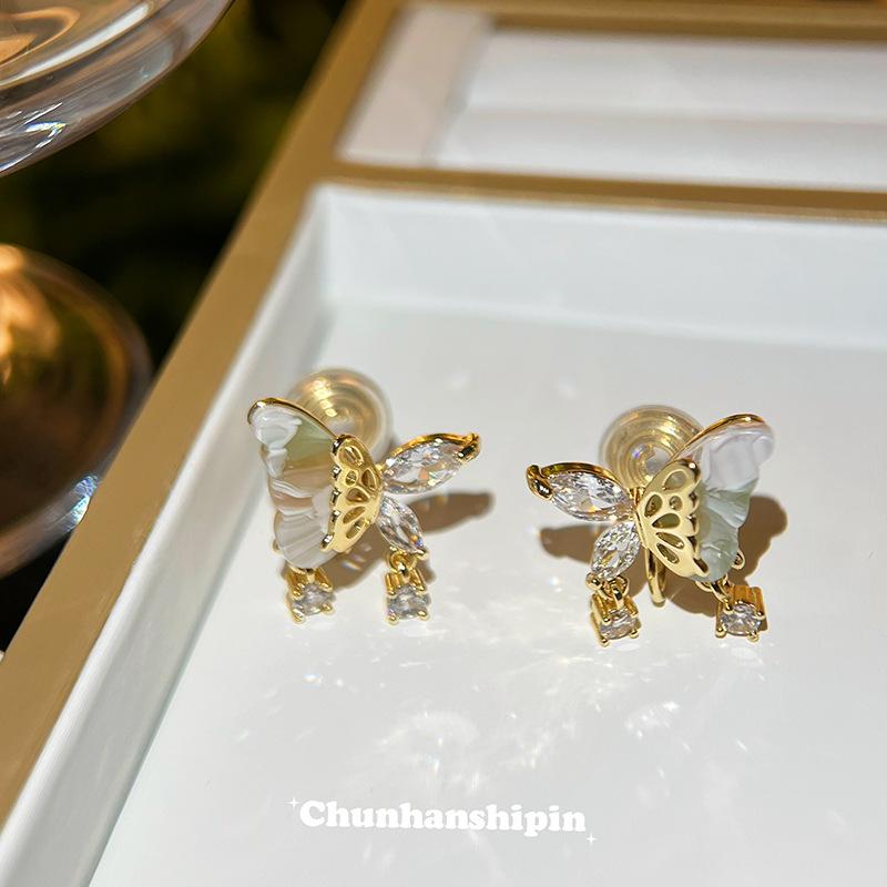 

Jade wind butterfly mosquito coil disc ear clips new Chinese stud earrings women s niche cold temperament earrings earrings without earrings