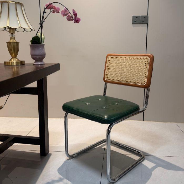 Elegantly crafted armless rattan dining chair in retro pastoral style, perfect for cafes, guesthouses, and vintage settings.