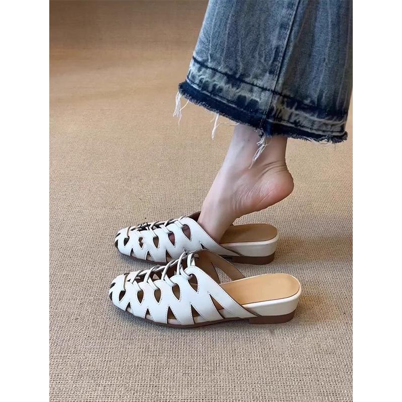 Niche design sense woven hollow Roman cool slippers women's 2025 new versatile one-pedal with skirt slippers