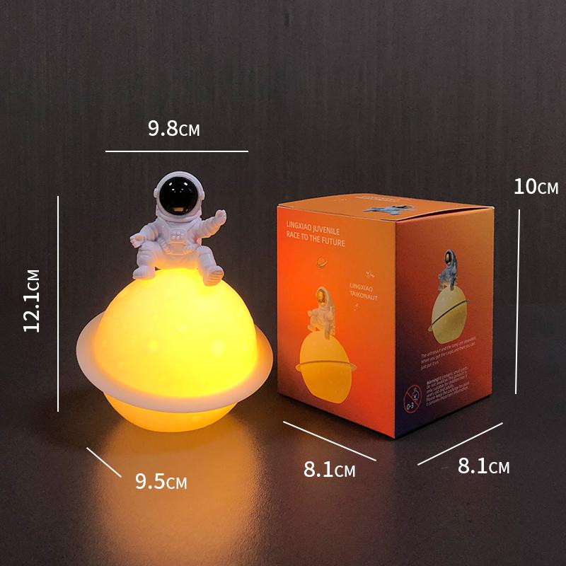 Astronaut Night Light Planet Lamp: Luminous Moon Ornament for Bedroom Decor, Gift, or Souvenir with Silk Flower.