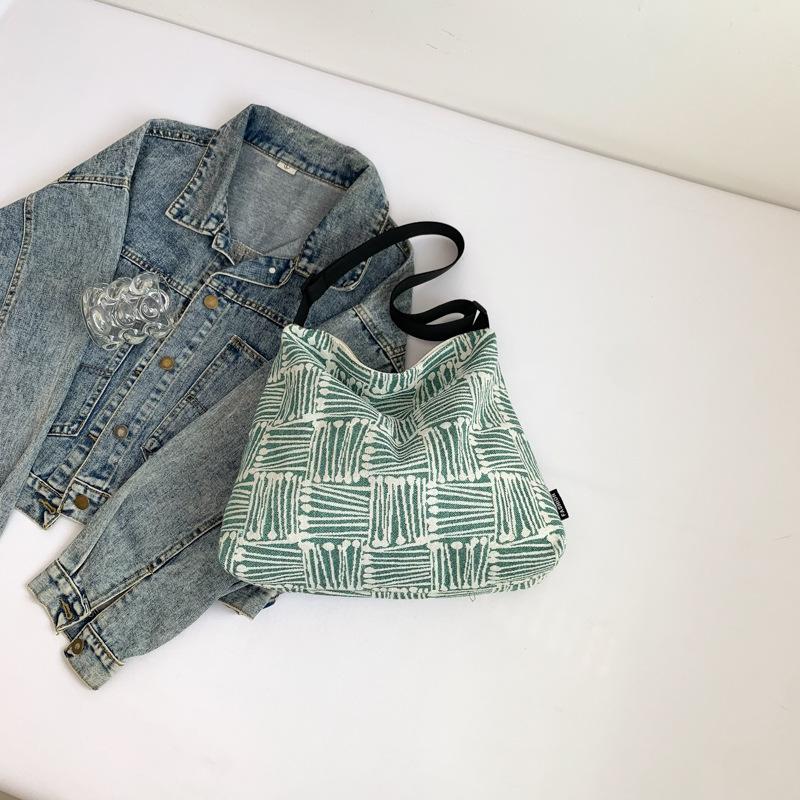 

Тканевая сумка 2025 осень новая большая вместимость холст высокая ценность клетка широкий плечевой ремень одно плечо мессенджер сумка-тоут зелёный