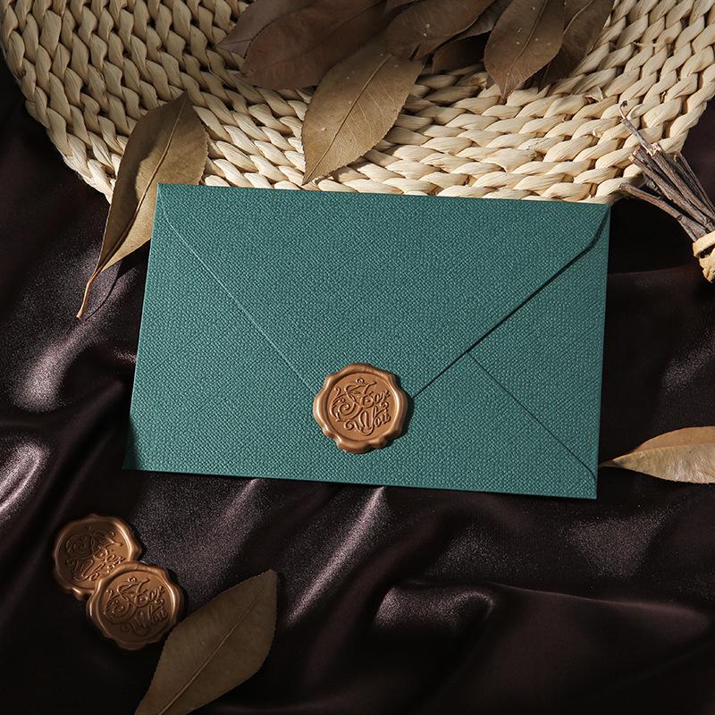 Retro Chinese Linen Pattern Letter Set with Kraft Paper, Sealing Wax, and Envelopes.