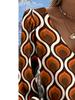 The new women's blouse features a printed V-neck long-sleeve design. It adopts Bohemian-style fringed sleeves and is perfect for spring.