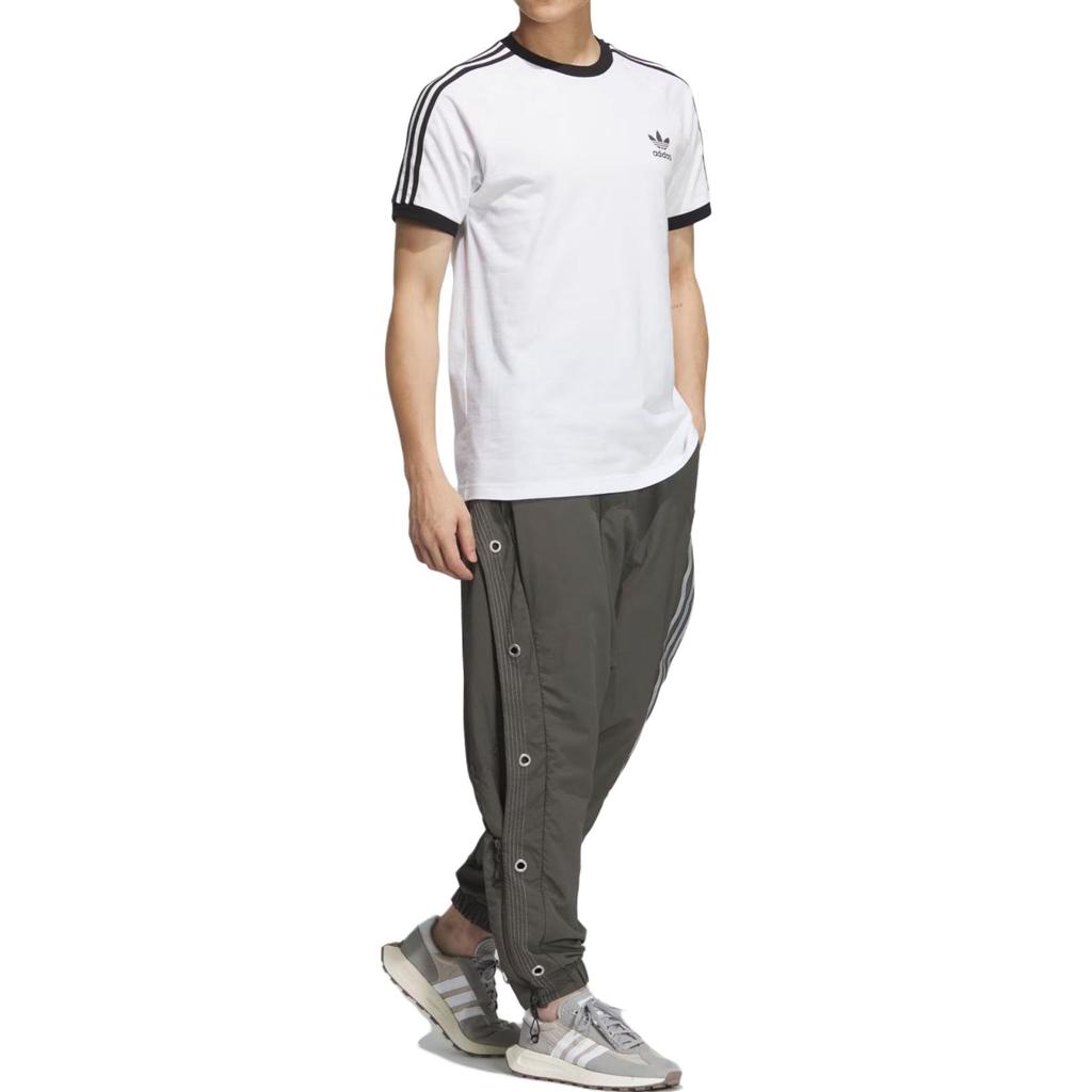 adidas Originals X Hamcus Kolaboracja Jesień/Zima 23 Trzy Paski Guziki Zatrzaskowe Boczne Sportowe Długie Spodnie Spodnie Unisex Ciemno-Oliwkowo-Zielone IX7078