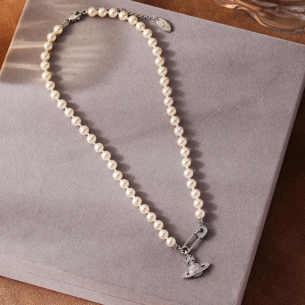 

Vintage Classic Pearl Choker with Saturn and Diamond Brooch