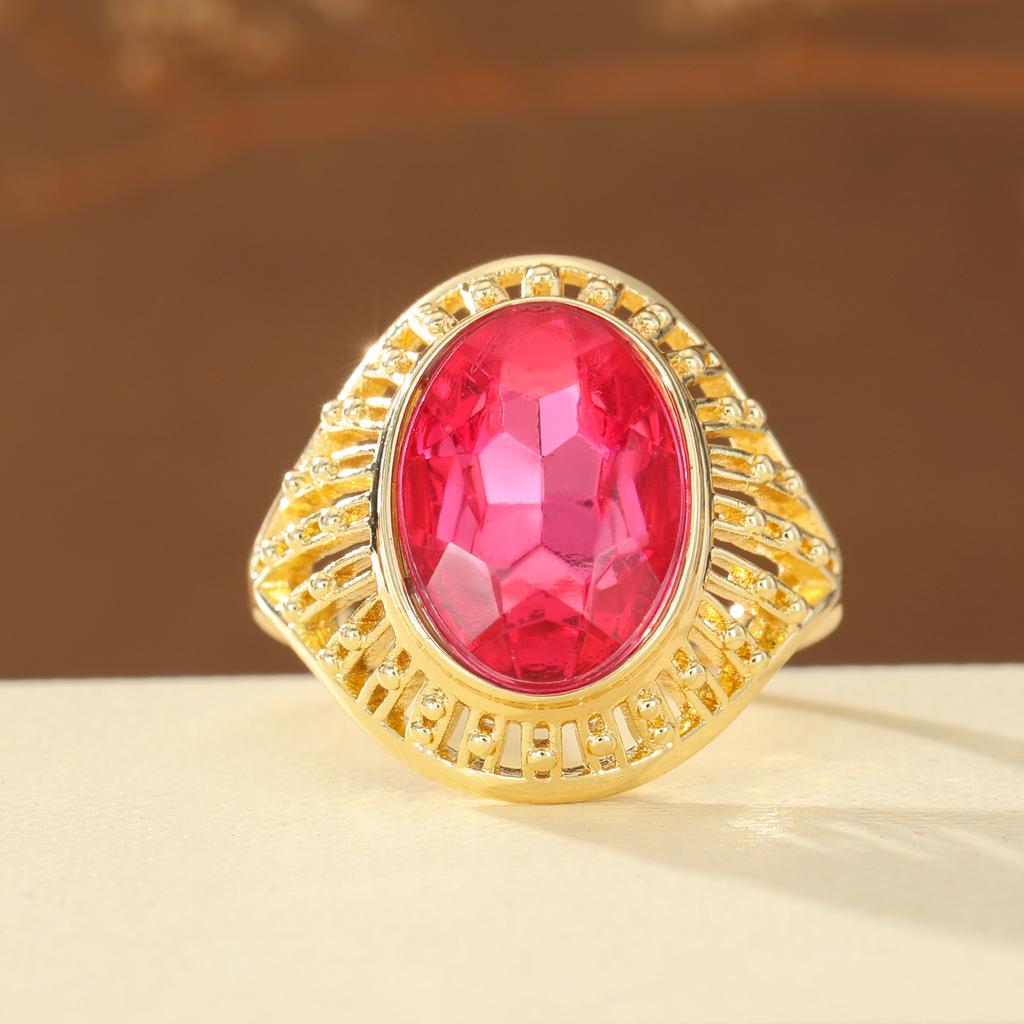 Vintage Hollow Copper Ring with Oval Red Artificial Gem for Women, Suitable for Banquets and Formal Occasions.