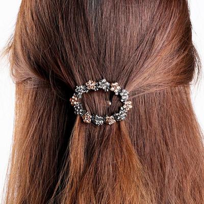 Retro Korean Hair Clip: Crystal Rhinestone Hairpin, Hollow Out Spring Style, Niche Ponytail Accessory.