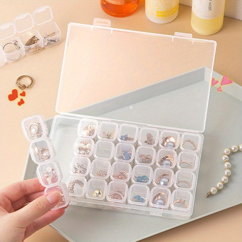 A Transparent Plastic Jewelry Box with 28/56 Compartments for Storing Earrings, Beads, and Crafts.