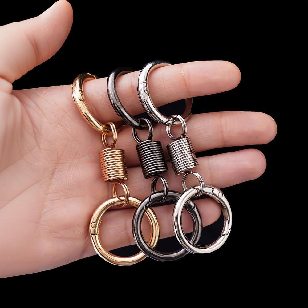 Creative Metal Double Loop Keychain with Pendant – Stylish Spring Ring Design
