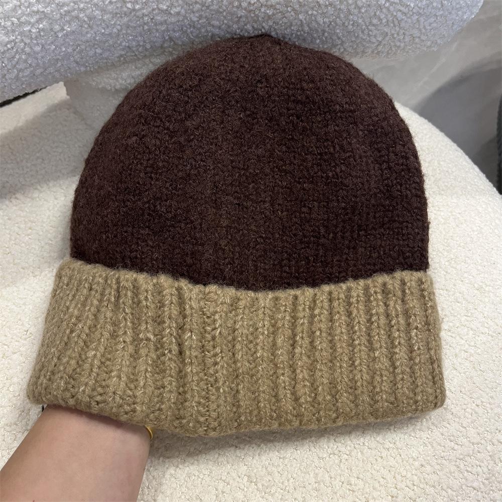 Simple two-color splicing wool hat women's autumn and winter warm niche versatile ear protection hat large version knitted pullover hat tide