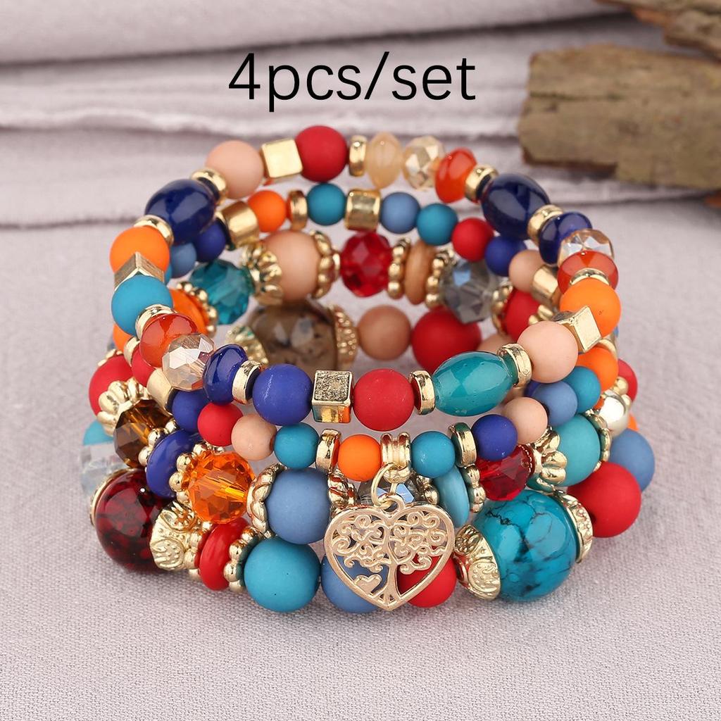 Bohemian Multi-Layer Tassel Bracelet Set with Hollow Heart Pendants and Glass Beads.