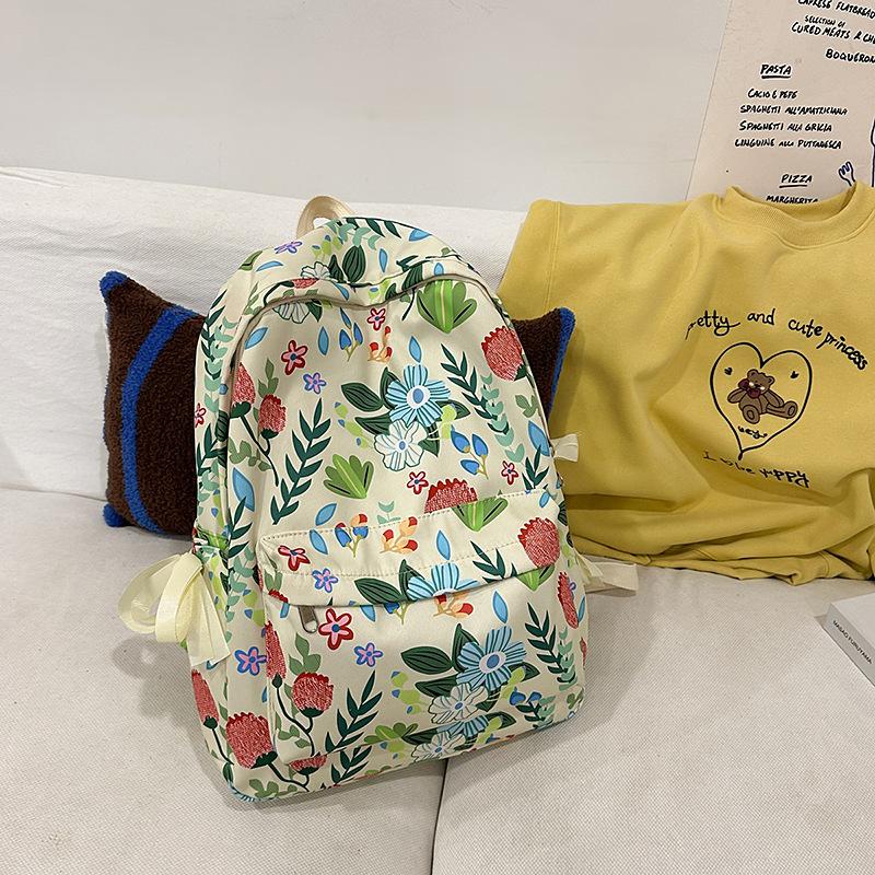 High-value schoolbag women's large capacity new fashion small floral backpack Japanese junior high and high school student backpack
