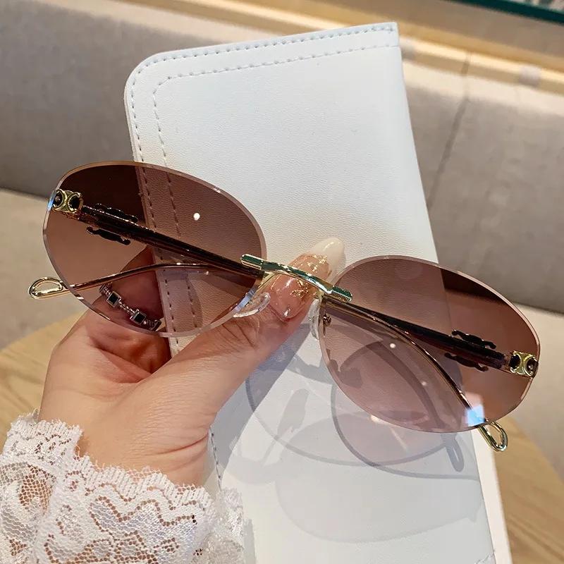 New Oval Metal Frameless Sunglasses Men'S And Women'S High-End Retro Fashion Sunscreen Glasses Uv400 Shades Eyewear