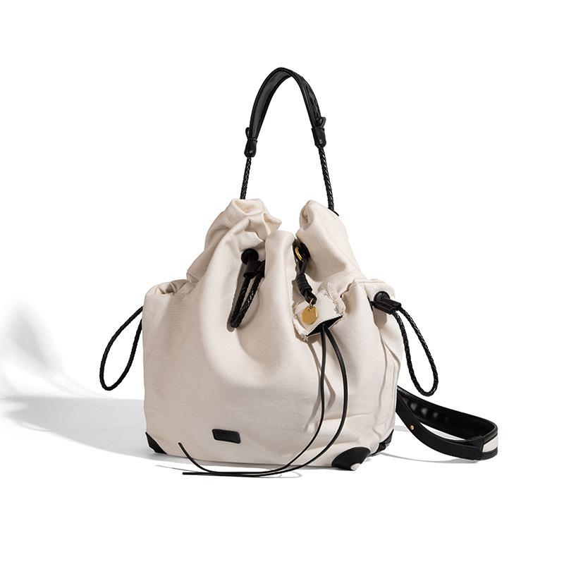 Niche Design Backpack for Women, Large Capacity 2025 New Vintage Canvas Commuter Drawstring Handbag School Bag
