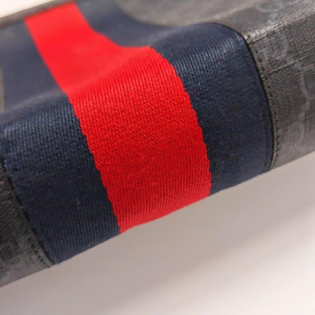 [Pre-Owned] Signature Logo Stripe Web Zipper Canvas Clutch - Fair #1Q4GJFX