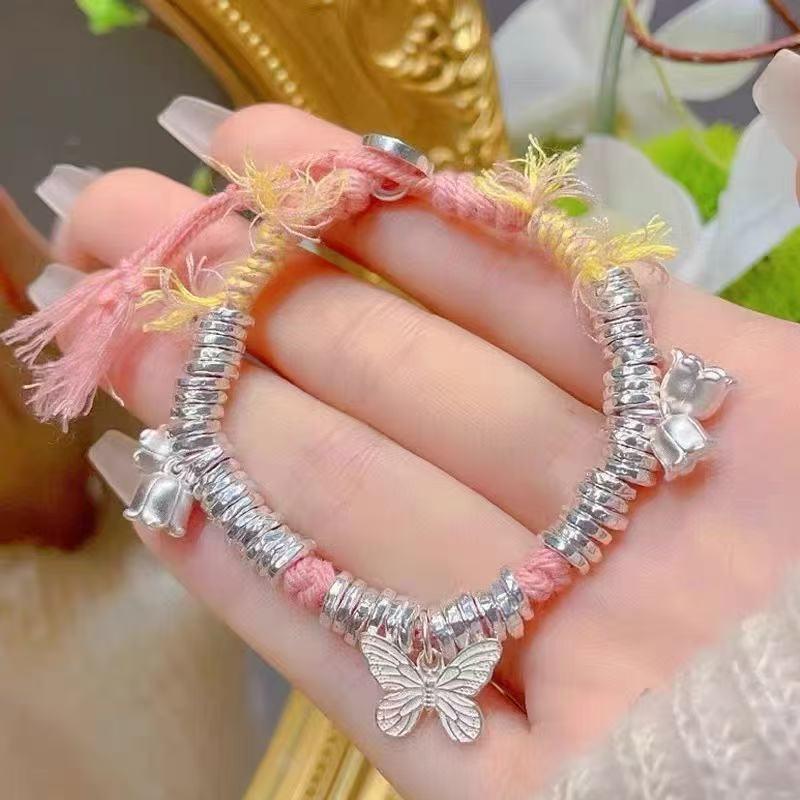 

White Copper & Silver-Plated Butterfly Bracelet with Lucky Bell, Coin, and Adjustable Crushed Silver Hand Rope.