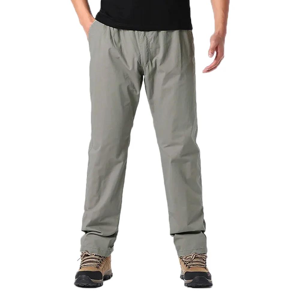 Wiosenne jesienne modne spodnie casualowe dla mężczyzn bawełniane spodnie cargo w jednolitym kolorze z elastyczną talią proste nogawki streetwear męskie spodnie joggers