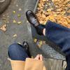 The New Style of Shoes Features A Retro Thick Heel and A Pair of Leather Shoes