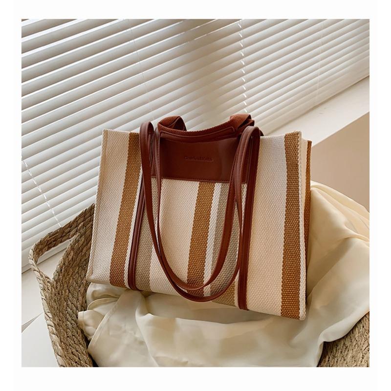 

Large-capacity canvas bag, new style, fashionable and simple texture, shoulder bag, contrasting color, portable commuter tote bag. коричневый