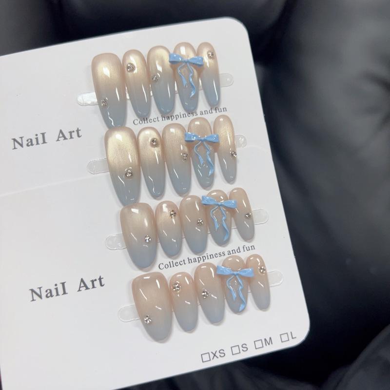 

Blue Gradient Cat Eye Nails with 3D Bow Beads