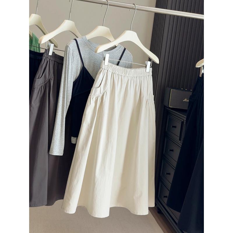 Spring and Autumn new elastic waist loose pocket skirt women's high waist A-shaped skirt big pendulum medium and long umbrella skirt