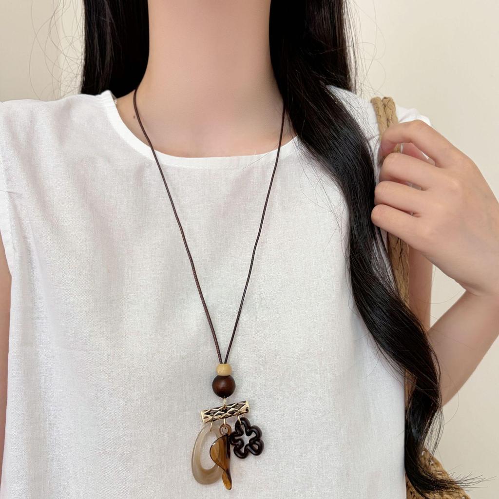Chinese Floral Tassel Pendant Necklace - Ethnic Niche Design for Women, Versatile Long Sweater Chain Fashion Accessory