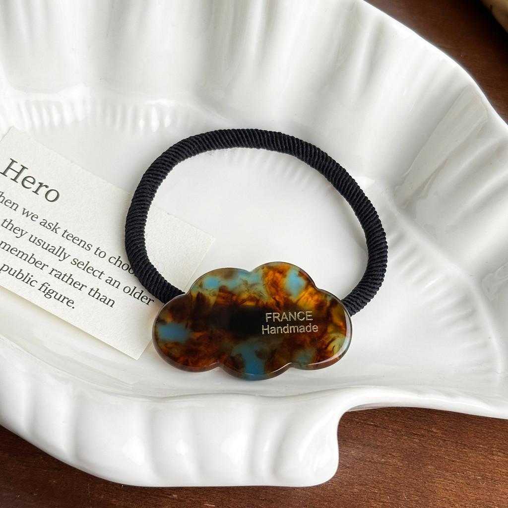 Fashionable And Stylish Acetate Cloud Hair Tie With Gold Accent And Elegant Hair Clip