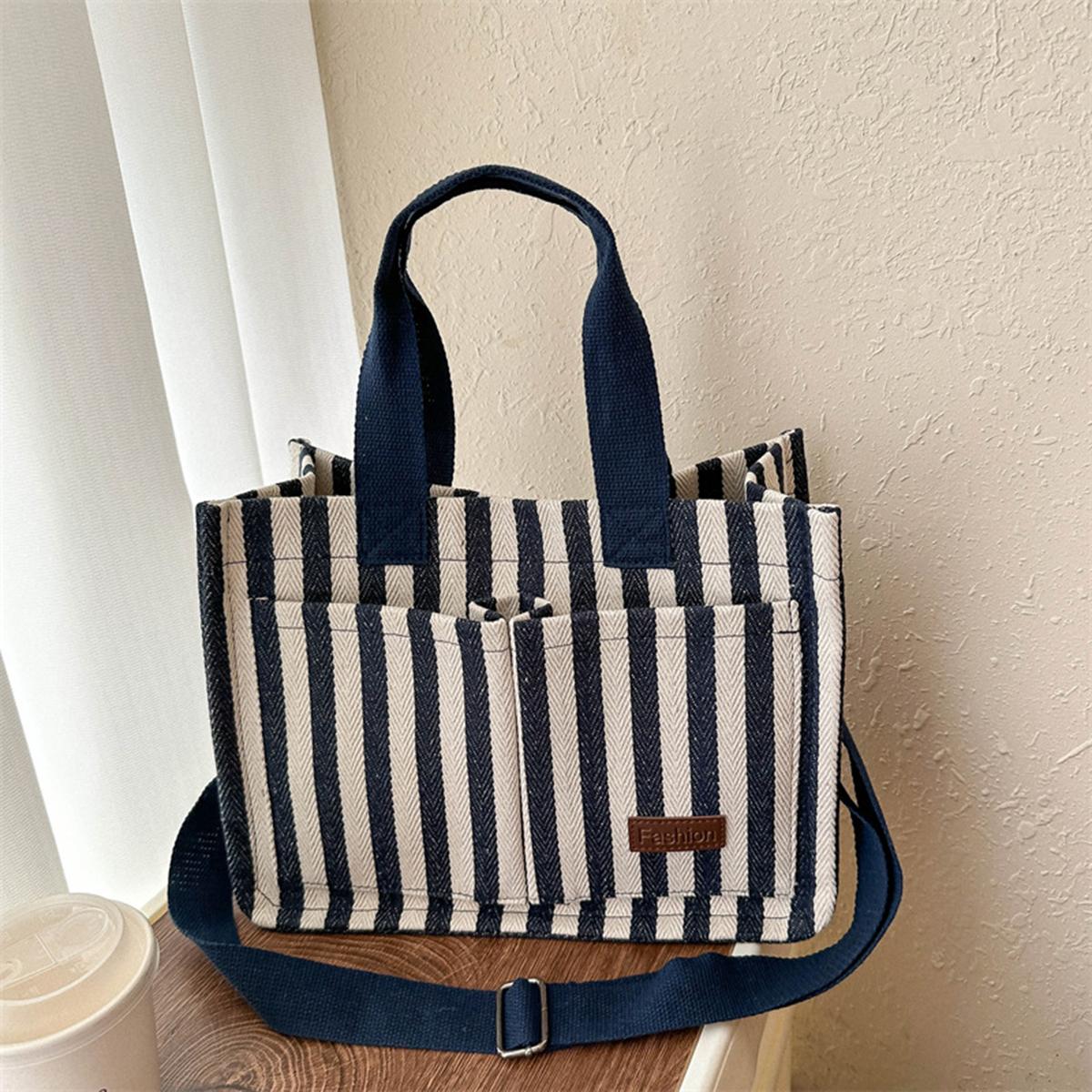 

New large-capacity fashiable striped handbag for women, casual shopping bag, made of canvas, e piece. синий