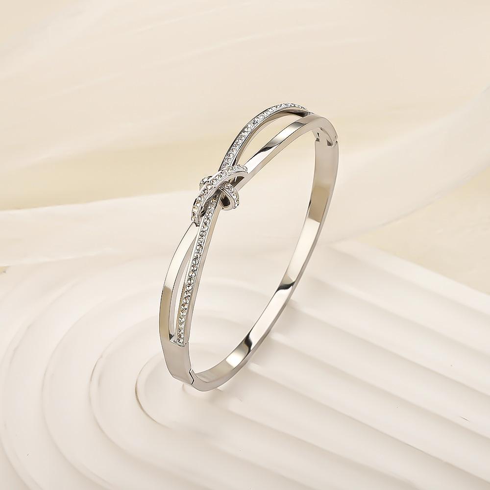 Classic titanium steel bracelet, stainless steel plated18k Gold bracelet with a simple and luxurious design, full of diamonds, featuring a bow and