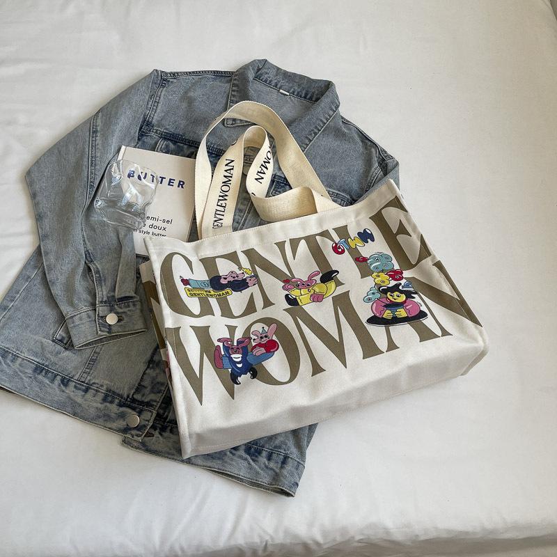 Canvas bag women's large capacity 2025 new bag portable commuter bag casual fashion fresh bag single shoulder mommy bag