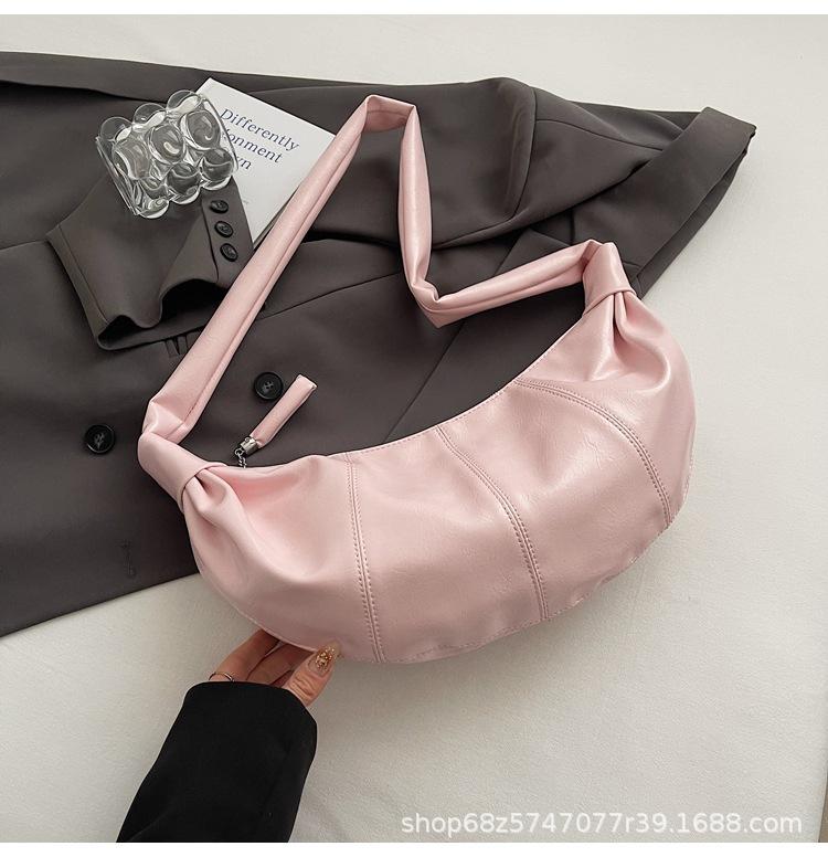 

2025 new niche fashion high sense niche shoulder bag women travel armpit croissant bag messenger bag розовый