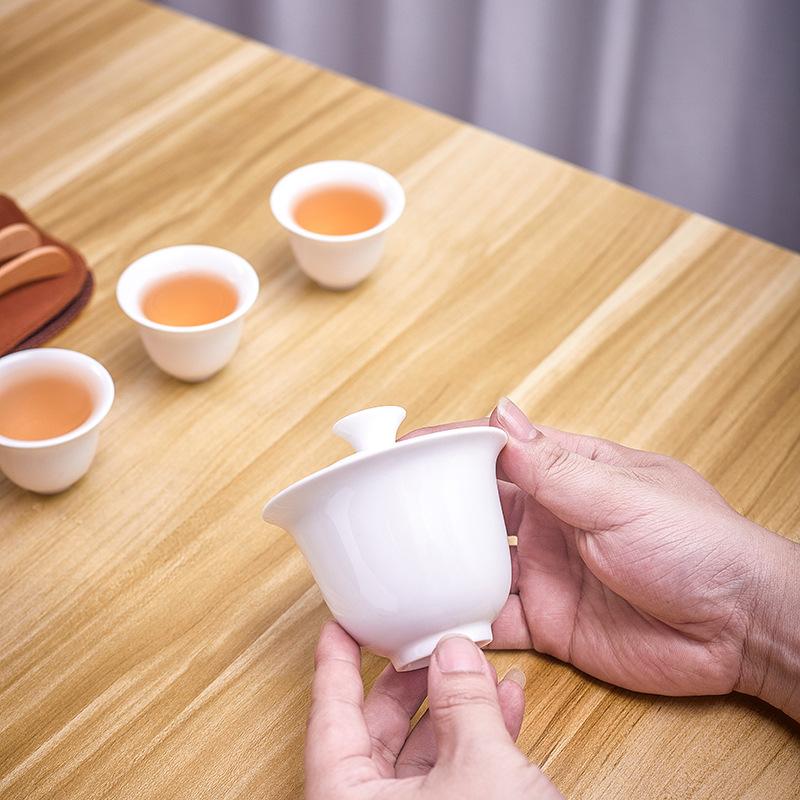 Dehua white porcelain tea set, practical ceramic cover bowl, one pot, four cups, outdoor storage, travel convenience bag, business small gifts