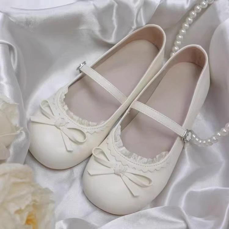 2025 new French retro white round head bow flat-soled single shoes women's spring one-pedal soft-soled beanie shoes
