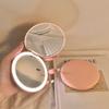 Portable LED Light Makeup Mirror - Compact, Handheld, Foldable, Round Mirror with Touch Light for Carry.