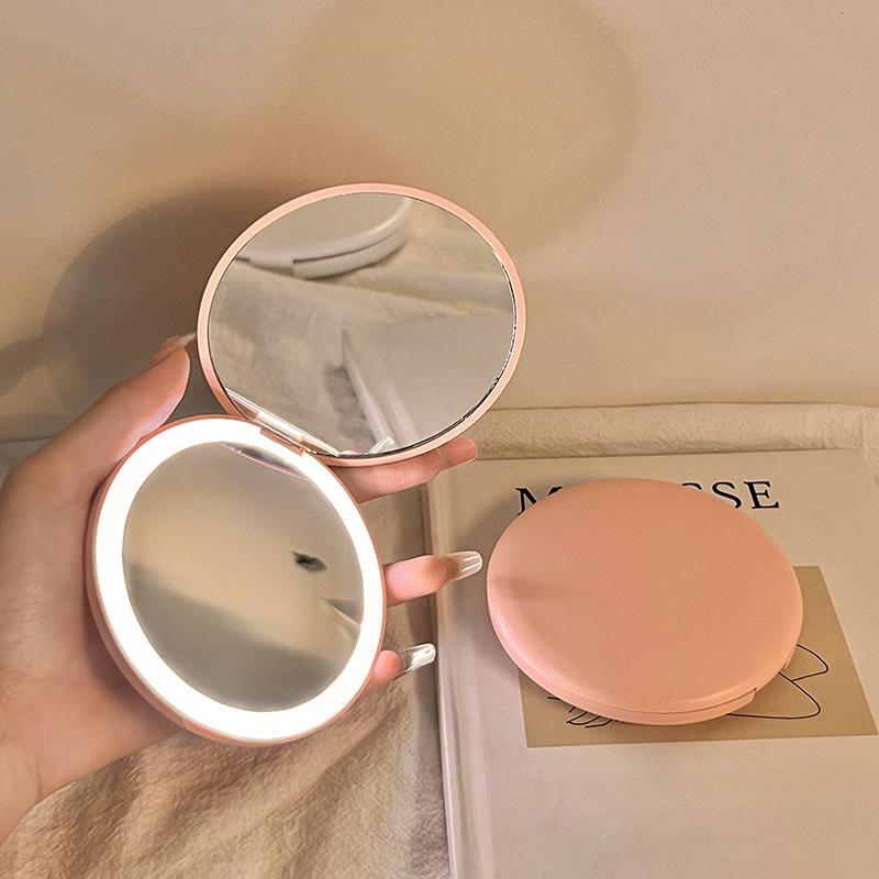 Portable LED Light Makeup Mirror - Compact, Handheld, Foldable, Round Mirror with Touch Light for Carry.
