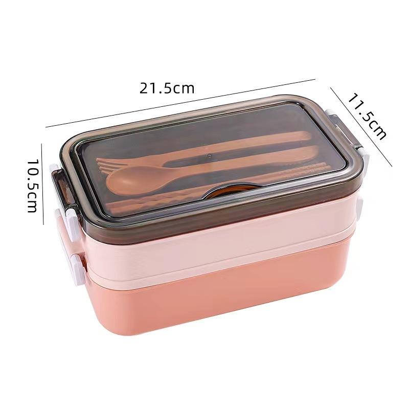 Dwupoziomowy lunchbox z przegródkami Zawiera widelec/łyżkę Łatwy do czyszczenia Wygodny w użyciu