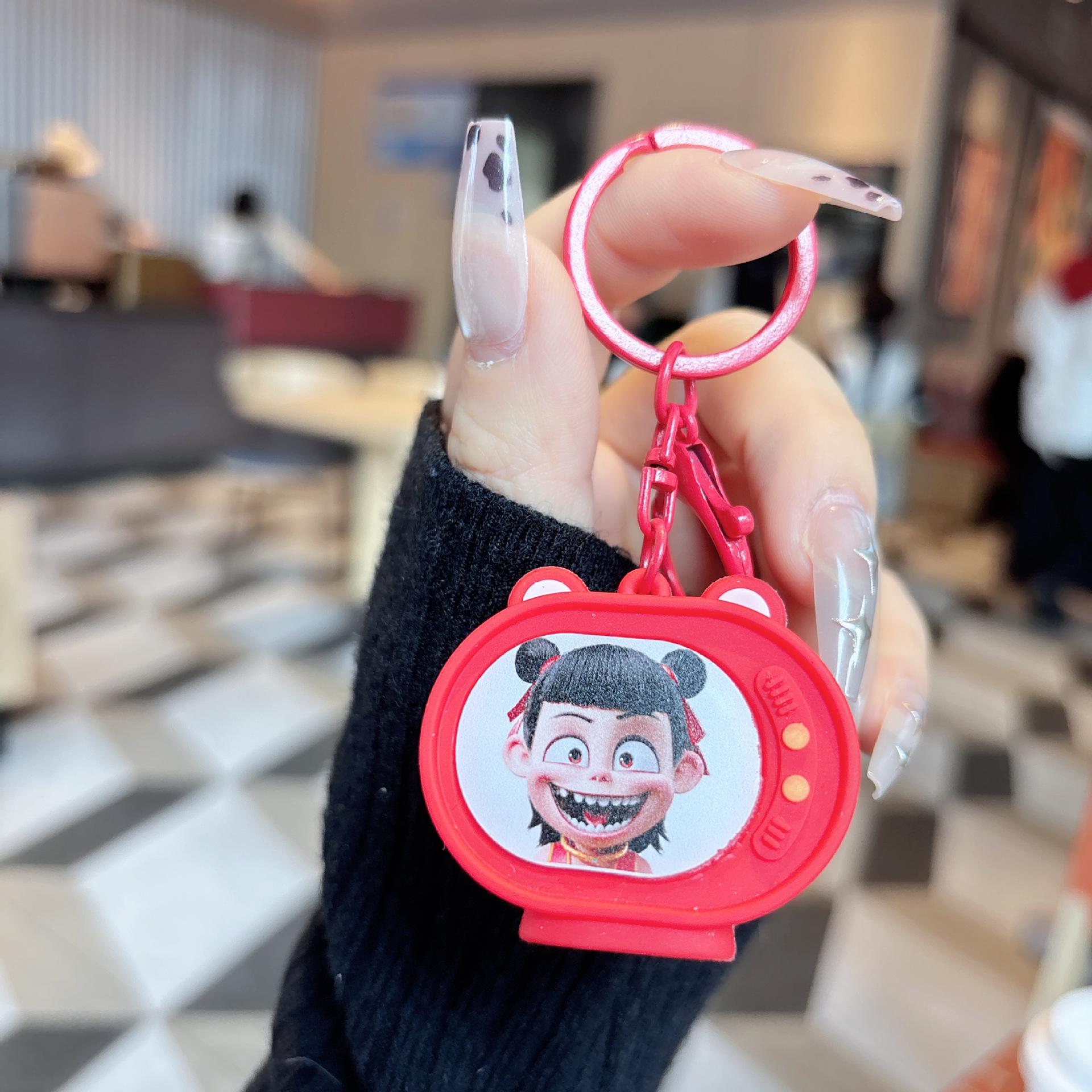 

Nezha Luminous TV Keychain with Light - Student Backpack Pendant Ornament.