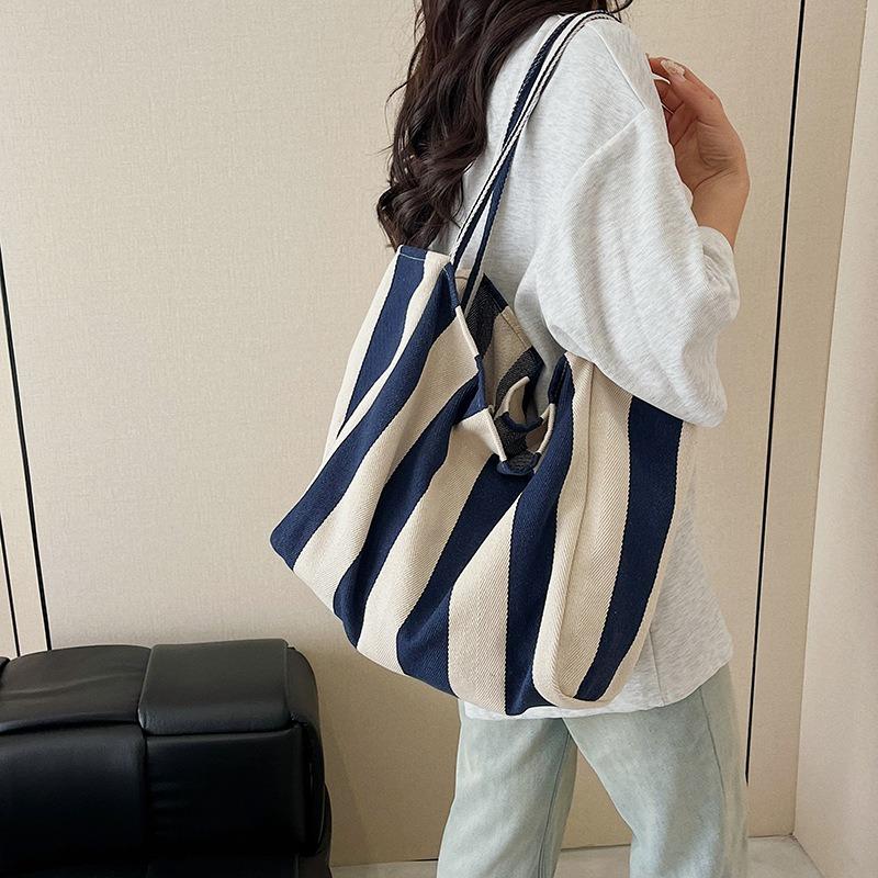 Korean version of casual canvas striped shoulder bag, new large-capacity simple shopping bag, personalized lazy vacation bag