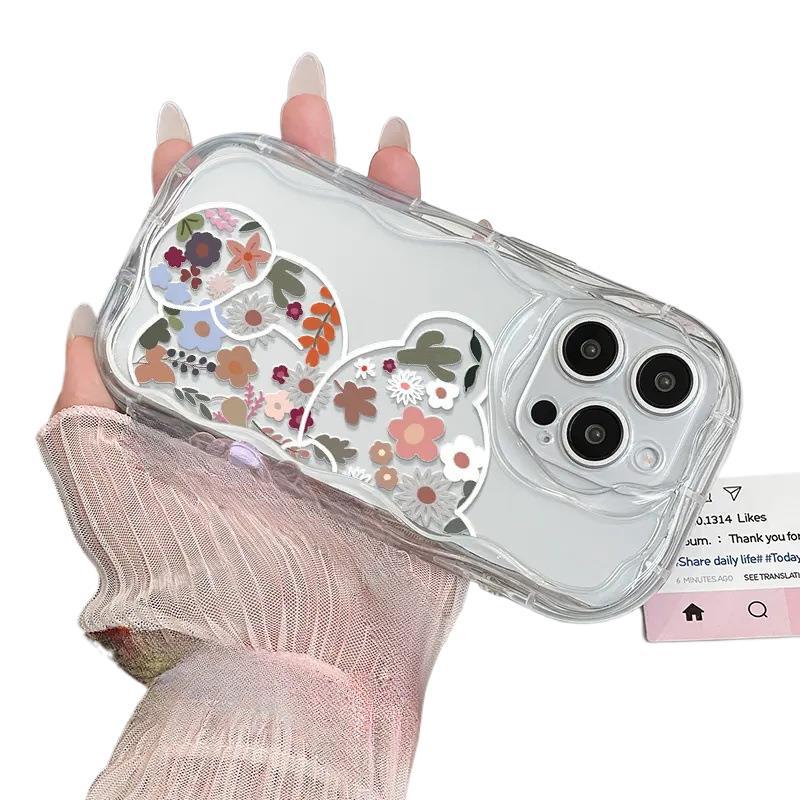 Vibrant flower bear is suitable for Apple 16promax mobile phone case, transparent iPhone17 airbag anti-drop protective case.