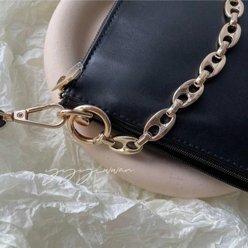 YSL black makeup crossbody bag with chain detailing, portable design, and large capacity, suitable for everyday use and travel.
